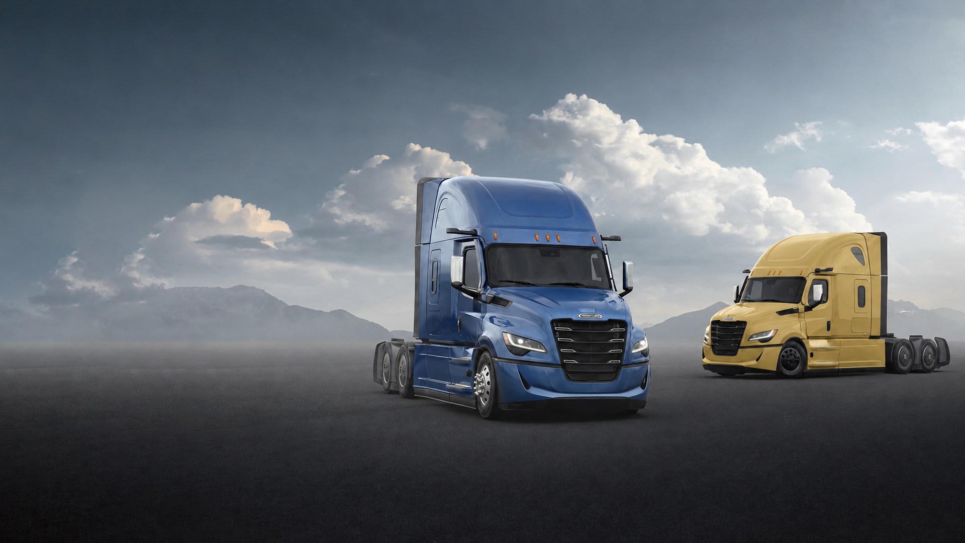 Two Freightliner Cascadia sleeper tractors parked on open asphalt under a cloudy sky.